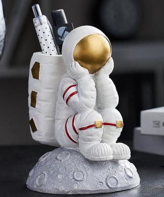 China Europe Z9 Birthday Gifts Resin Open Modern Astronaut Statue Pen Holder Office Desktop Sculpture for sale