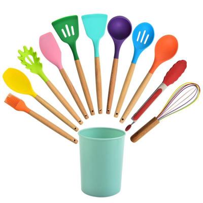 China Sustainable Hot Selling Multi Color 12 Piece Wooden Handle Silicone Kitchen Utensils Set With Rack for sale