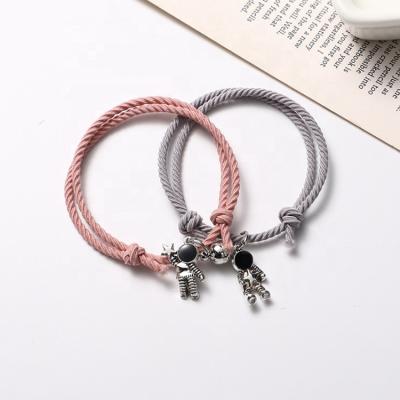 China Wholesale Men Women Fashion Hot Sale Environmentally Friendly Jewelry Gifts Couples Handmade Braided Woven Astronaut Pendant Magnet Lovers Rope Bracelet for sale