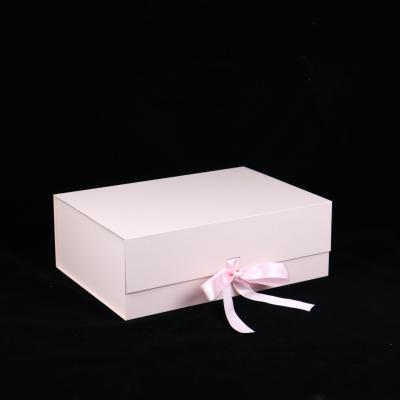 China Cosmetics Handmade Square Cardboard Boxes Gift Magnetic Paper Box For Clothes With Ribbon for sale