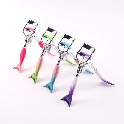 China New Multi-Functional Color Mermaid Wick Comb Gradient Stainless Steel Eyelash Curler And Eyelash Curling Curler for sale