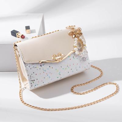 China 2023 Designer Fashion Women Handbags Fashion News Elegant Soft Golden Chain Strap Bag Famous Handbags Brands for sale