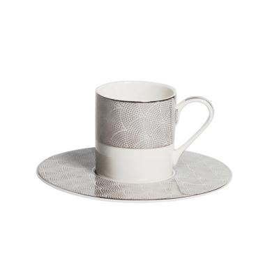 China Viable Creative Gift Set Bone China Balance Tea Cups Silver Saucer for sale