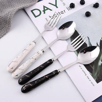 China Sustainable High Quality Custom Portable 304 Stainless Steel Dinnerware Silver Cutlery Set With Black Ceramic Handle for sale