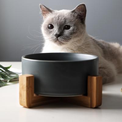 China Durable Ceramic Elevated Cat Bowl With Wood Stand No Puddle Pet Food Water Feeder Cats Dog Bowl Small for sale