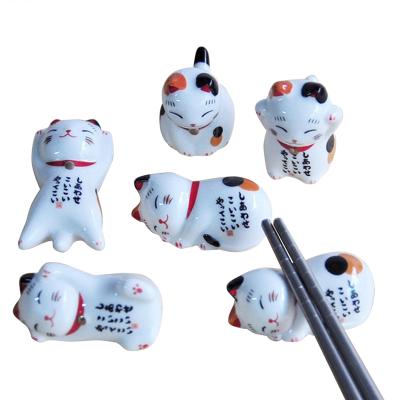 China Financially Sustainable Cute Lucky Cat Japanese Pen Stand Spoon Fork Chopstick Holder Rest Ceramic Chopstick Holders for sale