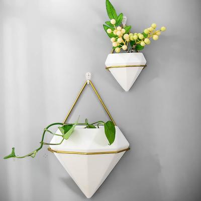 China Modern Geometric Ceramic Flower Pot Holder Garden Vertical Wall Hanging Planter Hanging Succulent Pot for sale