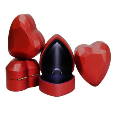 China Heart Shaped Creative High Gloss Painting Jewelry Box LED Ring Display Pendant and Ring Lamp Storage Box with High-Grade Plush Inside for sale