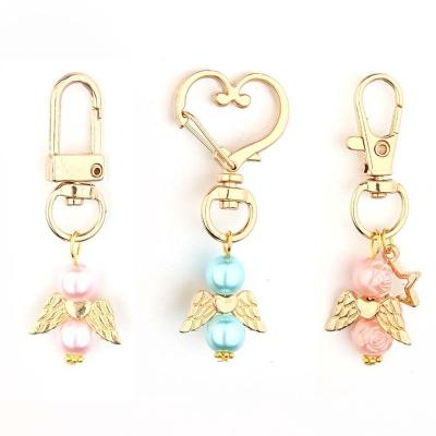 China Wooden Angel Favor Pearl Keychains Baptism Favor Guest Key Chain Return Favors Key Chains For Girl Boy Baby Shower Wedding for sale