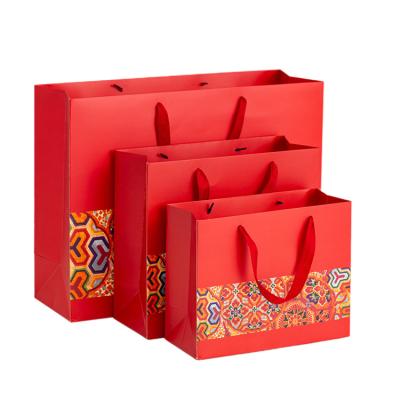 China Recyclable Wholesale Custom Printed Gift Luxury Shopping Paper Bag With Handle for sale