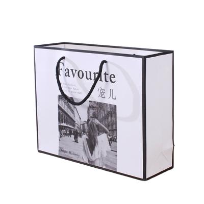 China Custom Logo Clothing Packaging Paper Shopping Recyclable Retail Bag Gift Cosmetic Paper Bag for sale