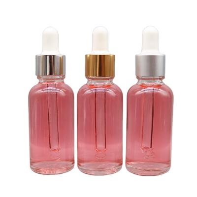 China Custom Clear Round Cosmetic Oil Bottles Serum Bottle 30ml Essential Glass Dropper Bottle With Gold Silver Dropper Cap for sale