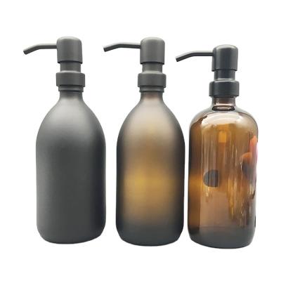 China Personal care 250ml 500ml frosted emulsion pump glass bottle shampoo bottle mousse amber lotion bottle with matte black metal pump for sale