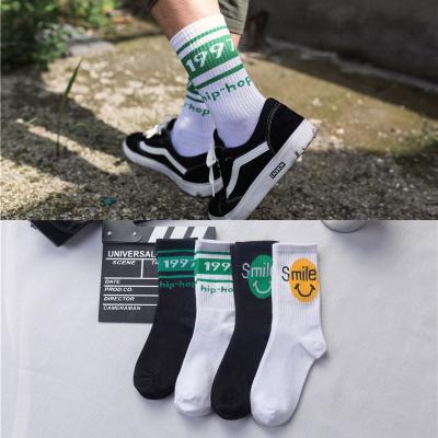 China Wholesale breathable hip-hop mid-tube letters street sports smiling socks Sweat-absorbent socks for sale