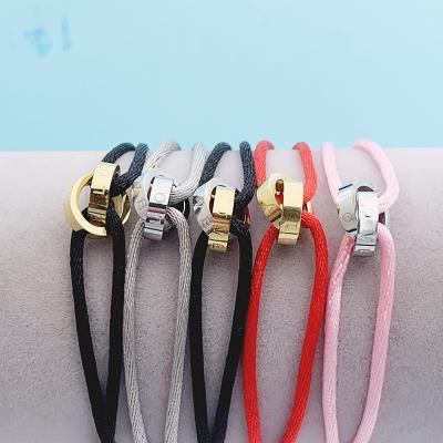 China High Quality Romantic Stainless Steel Circles Two Cross Bracelet With Adjustable Rope For Men Women Unisex for sale