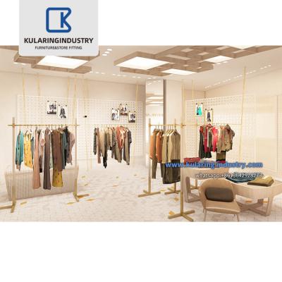 China Retail store for sale hot metal cafe clothing retail store display rack suitable clothes show floor type garment boutique apparel rack with shelf for sale