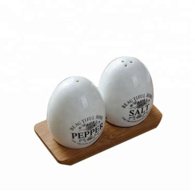 China Sustainable Funky Decorative Airline Egg Shape Small Ceramic Salt And Pepper Shaker for sale