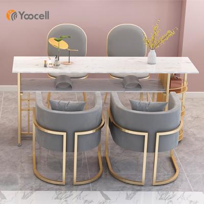 China High quality multi storage space Yoocell gold frame nail table pink color manicure table beauty nail chair for sale