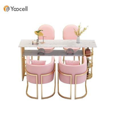 China Multiple Storage Space Yoocell Nail Table Manicure Table Nail Salon Furniture Nail Technician Tables in Pink Color for sale