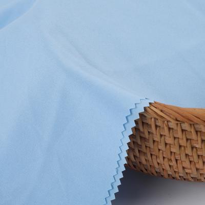 China Premium Poly Stretch Sky Blue Elastane Plain Weave Blend Fabric For Garment for sale