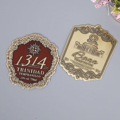 China OEM Design Anti-Counterfeit Custom Shape Embossed Metal Brand Logo Aluminum Label Adhesive Perfume Metallic Stickers for sale