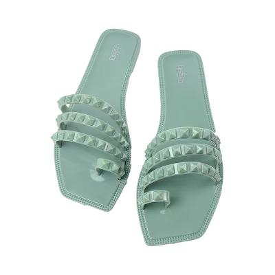 China 2022 fashion trend new rivet open toe shoes outdoor beach shoes jelly flat freeze women's sandals ladies slippers for sale