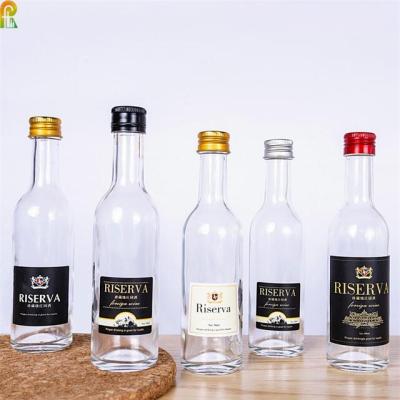 China Craft Spirit Factory Hot Selling Square Liquor Bottles Mini 50ml 100ml Liquor Glass Bottles for sale