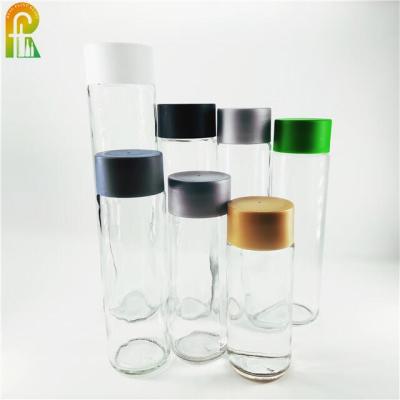 China Quiet Wholesale Transparent Empty Wine Voss Glass Bottle For Juice Water Milk Beverage Soda With Plastic Cap for sale