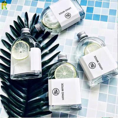 China Empty Glass Bottle Flask 50ml 100ml Small Essential Oil Wine Bottle Mini Retro Liquor for sale