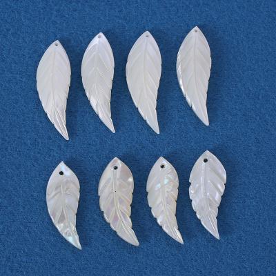 China Shell Wholesale of natural shell feather shaped white DIY small shells for jewelry and clothing production for sale