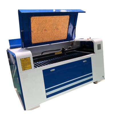 China Laser Cutter Laser CUTTING 50w Laser CO2 Laser Cutter Wood Engraving And Cutting Machine for sale