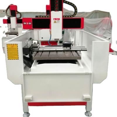 China GJ-6060 CNC Stone Wood Router Metal Wood Milling Machine with 4 axis with DSP controllor with water tank table for metal wood stone for sale