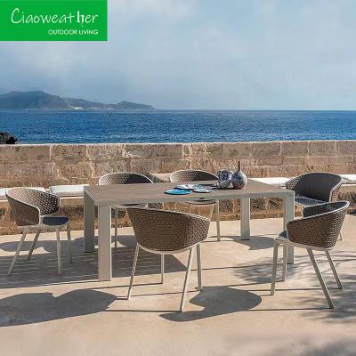 China Outdoor Leisure Hotel Rattan Dining Set with Waterproof Upholstery Cushion and Aluminum Frame in Modern Simplicity Design for sale