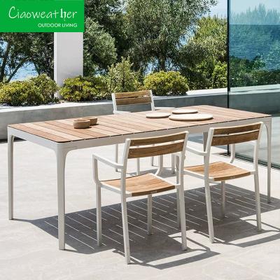 China Customized Designs Luxury Patio Furniture Set Solid Wood Dinning Table with Teak Wood Tabletop and 6 Plastic Wood Chairs for sale