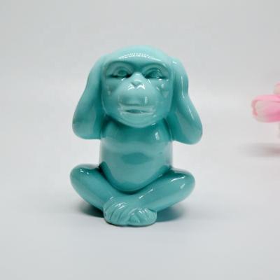 China Creative Ceramic Monkey Money Box Design Monkey Piggy Bank for sale