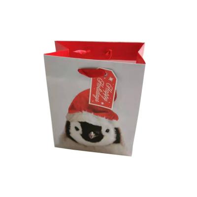 China Recycled Materials Wholesale Mini Kraft Paper Christmas Gift Bag With Handle And Custom Logo Shopping Paper Bag for sale