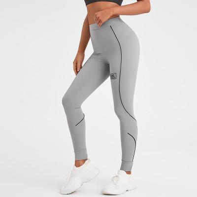 China Breathable Women's Casual Sports Style Line Contrast Color Band Waistband Elastic Slim Sports Tight Pants High Waist Trousers Pants for sale