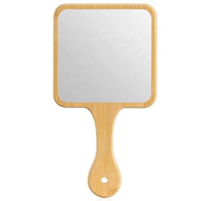 China New design 2022 amazon hot sales Cheap Natural Bamboo Hand Mirror with Handle for Shaving for sale