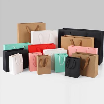 China Factory Wholesale Recyclable Luxury Gift OEM Kraft Paper Bag Gift Shopping Bag With Custom Logo for sale