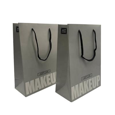 China Custom Recyclable Luxury Glossy Gray Paper Logo Shopping Bags Bag For Cosmetics for sale