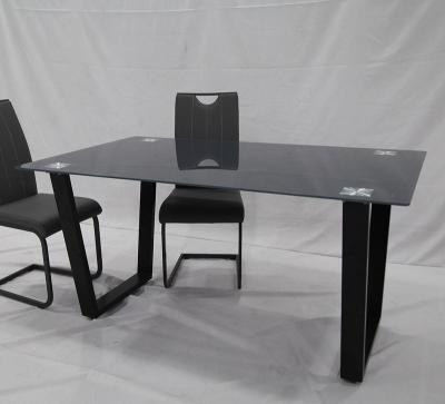 China Modern Contemporary Imported Iron Tube Legs Tempered Glass Top Kitchen Luxury Black Coating Dining Table for sale