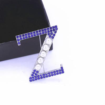 China Custom Popular Support Metal Letter Z Pin Blue Stone White Pearl ZETAA Brooches Brotherhood Party Gift Jewelry for sale