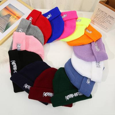 China JOINT wholesale unisex cheap winter beanie hats knitted custom logo slouchy hat for women hot for sale