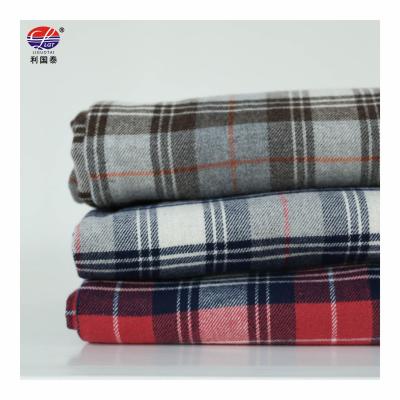 China Hot Sale Custom Stock Winter Organic Ready To Ship Feeling 100% Wadding Check Flannel Plaid Fabric for sale