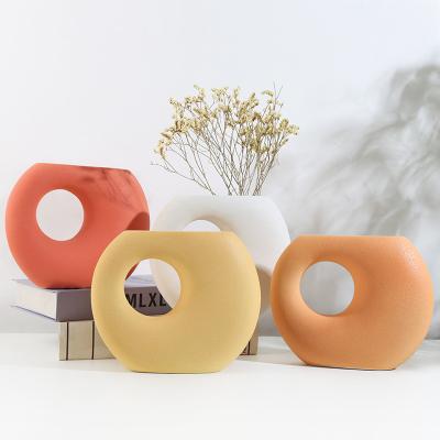 China Modern Nordic ceramic vases other household decorations ceramic colorful luminous vases suitable for wedding vases around ceramic for sale