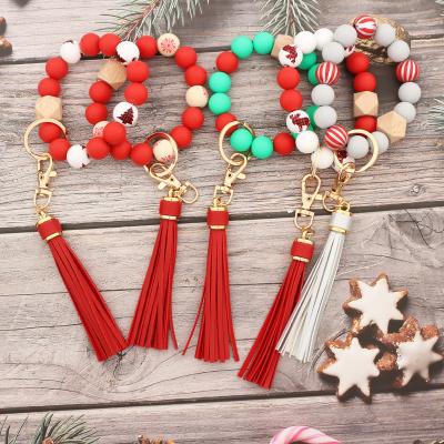 China Colorful Silicone Wood Beads Christmas Buffalo Plaid Elk Pattern Wooden Silicone Beads Bracelet Keychains Women PU Leather Tassel Bracelet Key Chains for sale