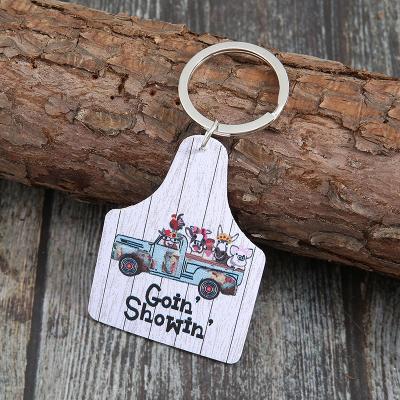 China Vintage PU Leather Handmade Animal Printing Letter Leather Key Chain Truck Cow Pattern Geometric Key Chain Leather Keychain for sale