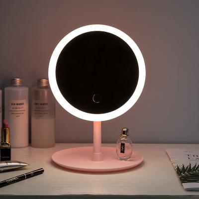 China New Lighted Cosmetics Desktop Sauce Mirror Charging Small Round LED Light Makeup Mirror for sale