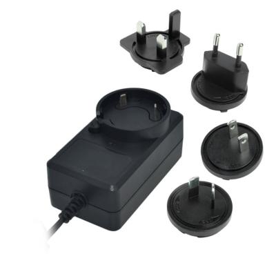 China New Arrivals 12V 2A Power Adapter Eu Us UK Au Plug 12V 2A Interchangeable AC DC Power Supply With Ce U l TUV Approvals 86.8*50*33 for sale