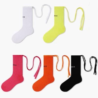 China Girls Sporty Stylish Casual Teens Cotton Strap Solid Color Fluorescent Crossover Tube Socks Women Socks for sale